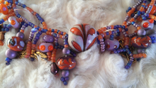 Orange and purple hand-blown beads.